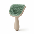 Sage green and beige calming grooming brush for anxious cats